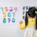 Girl in yellow learning alphabet