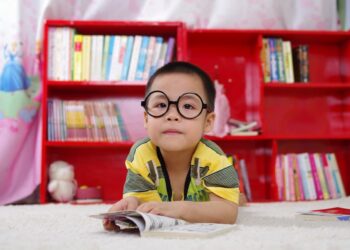 Kid reading books in the library