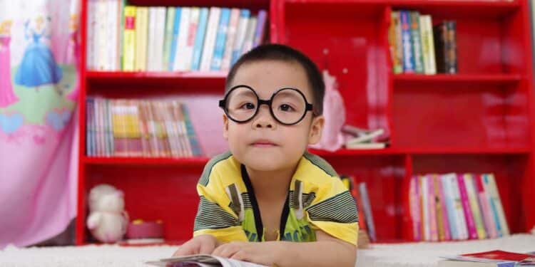Kid reading books in the library
