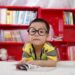 Kid reading books in the library