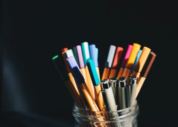 Assorted pens inside a pen holder