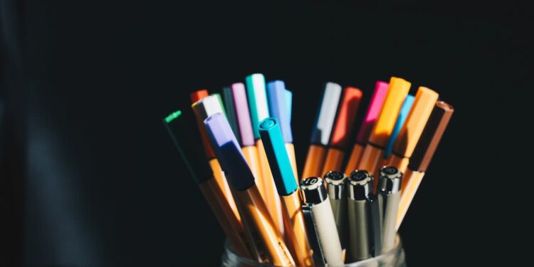Assorted pens inside a pen holder