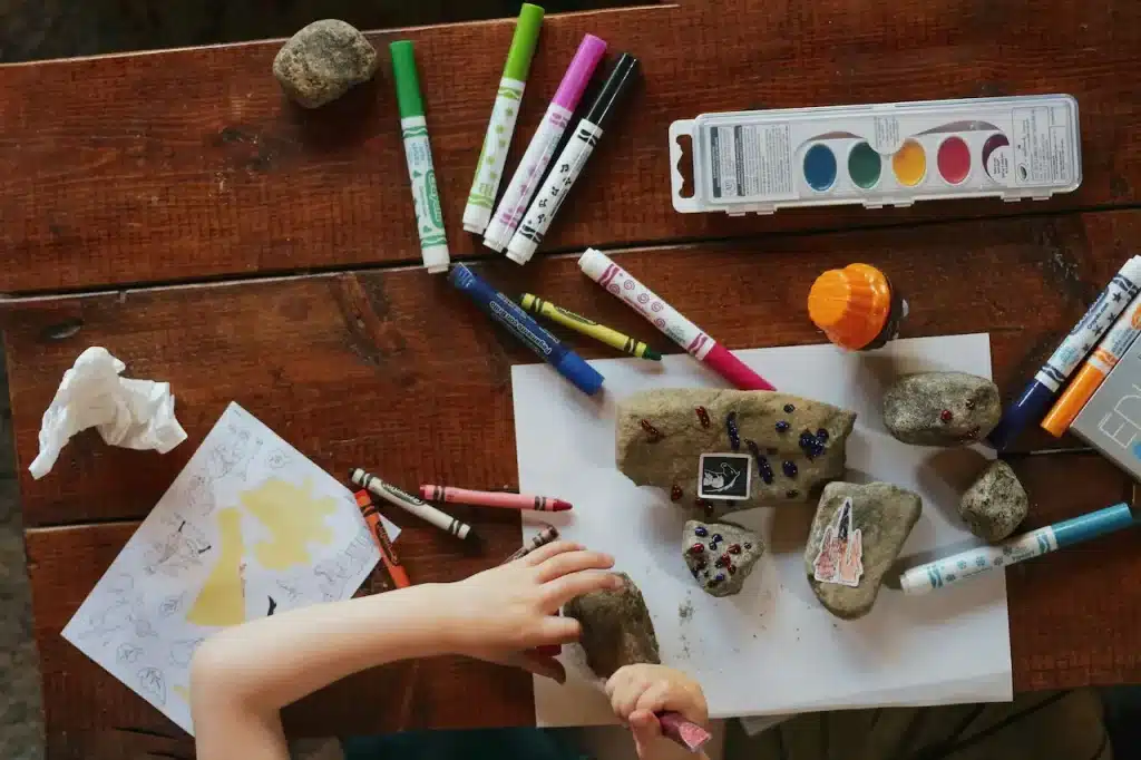 A Little Kid Creating a Pretend Pet with a Rock 