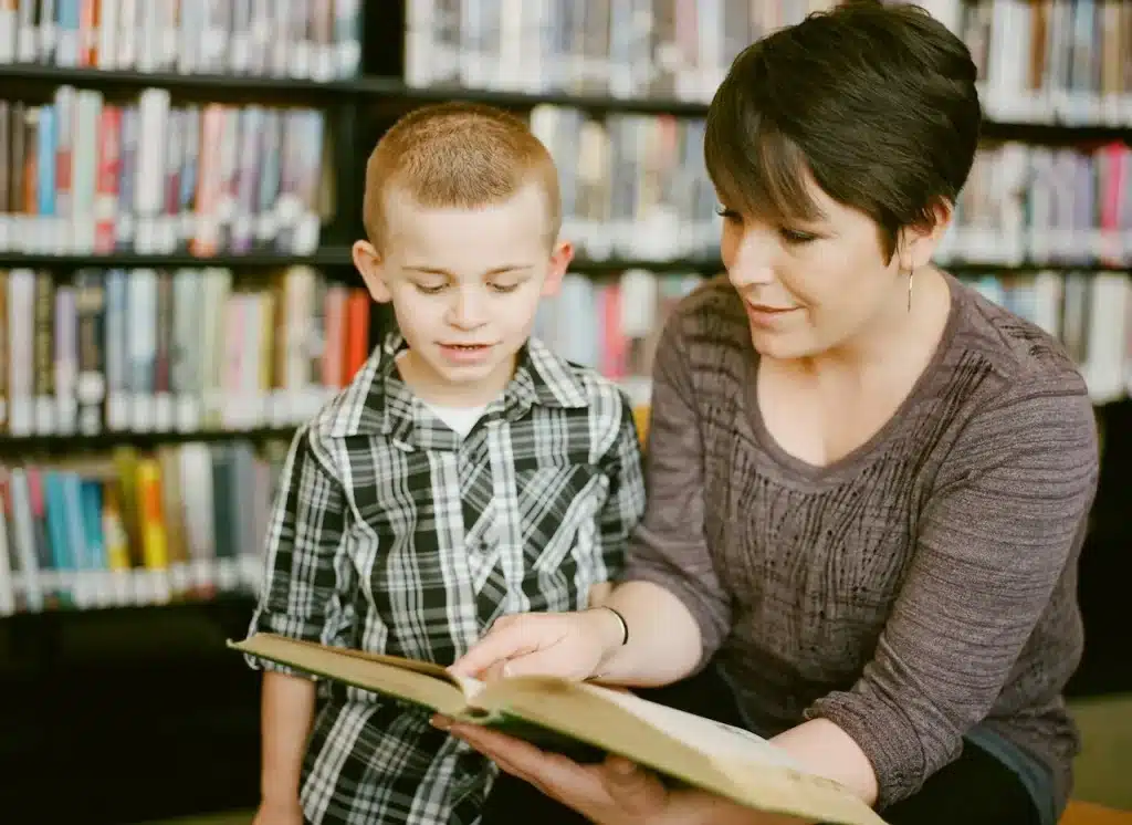 Woman Teaching a Young Boy to Read 